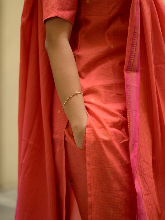 handloom cotton suit set with gold woven buttas in orange & pink